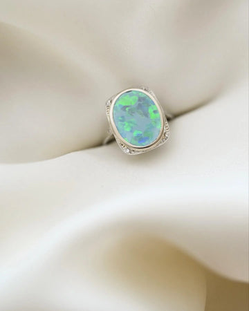 Antique Art Deco ring with opal and diamonds in 18K white gold