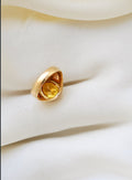 The underside showing the open back, the citrine glowing through