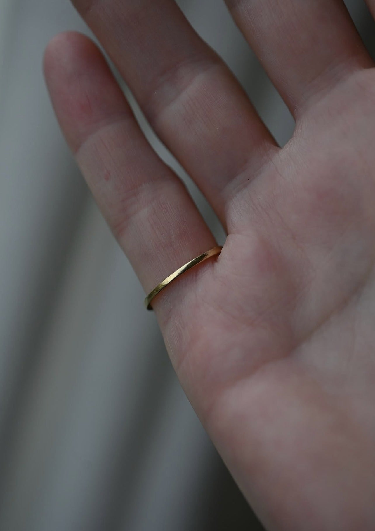 The slim gold band seen from the palm side