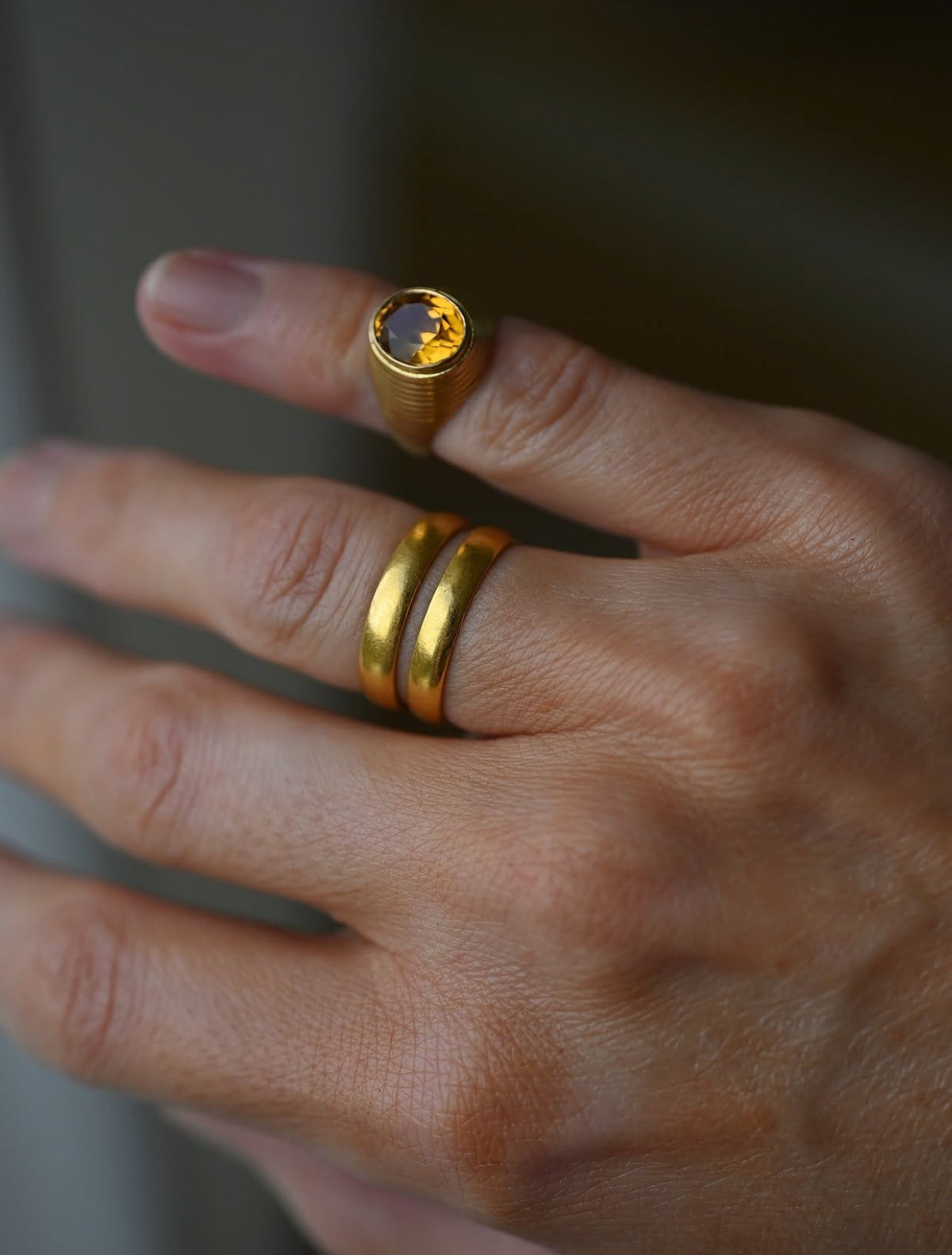 The bands stacked on the ring finger