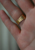 The stamped borders seen from the palm side