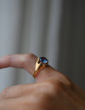 Antique Blue Topaz Ring Size 6 US 18K Gold Sweden 1922 worn on the hand, the stone held in a buttercup setting