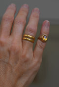 The citrine ring worn on the pinky, styled with stacked gold bands