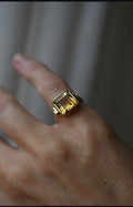 The citrine ring on the hand showing the stepped Art Deco shoulders
